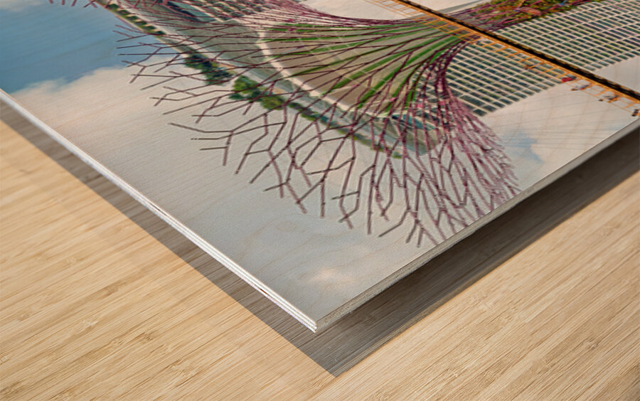 People walk on bridge connecting to Supertree Grove in Singapore Wood print