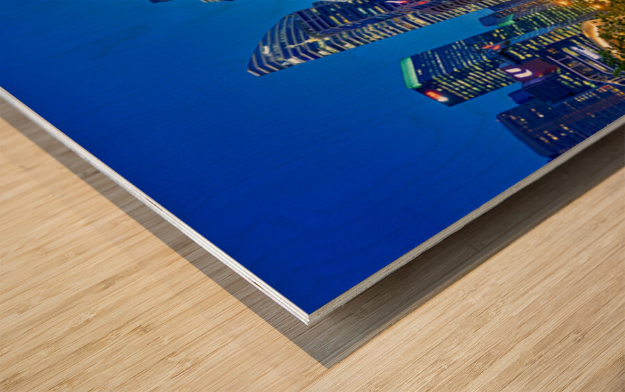 People walk by the waterfront in Marina Bay during sunset in Sin Wood print