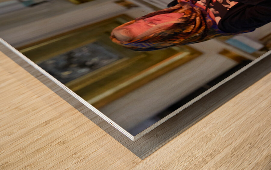 Woman lights candles at Alexander Nevsky Lavra Wood print