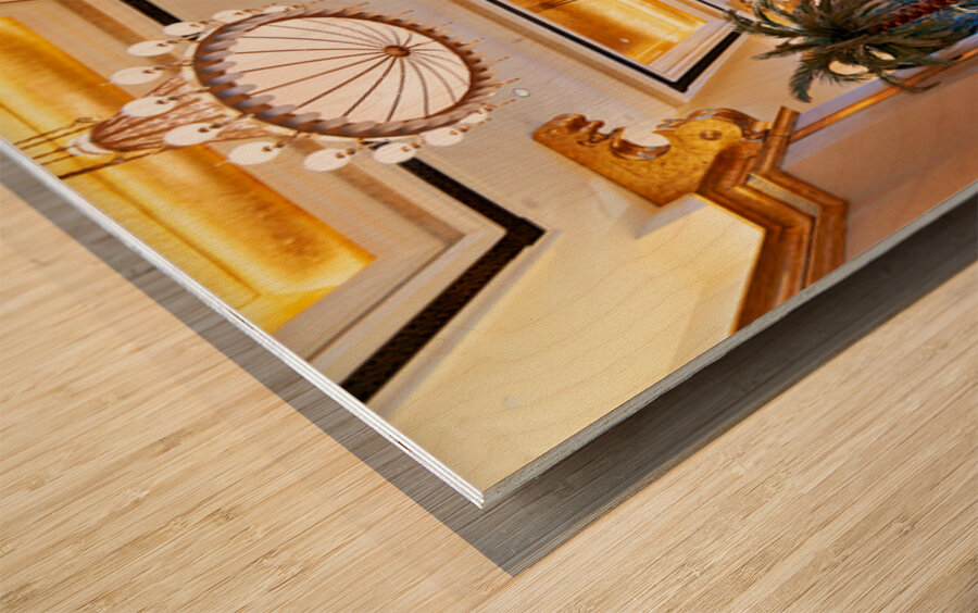 Visitors stroll through Emirates Palace Hotel lobby Wood print