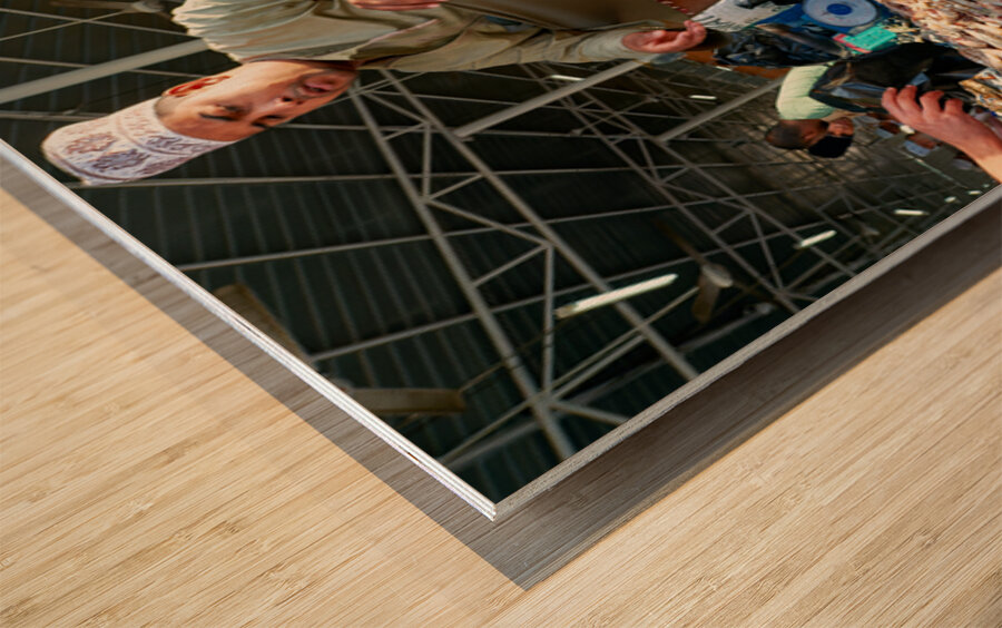 Fish market in Muscat Oman shows vendor and fresh catch Wood print