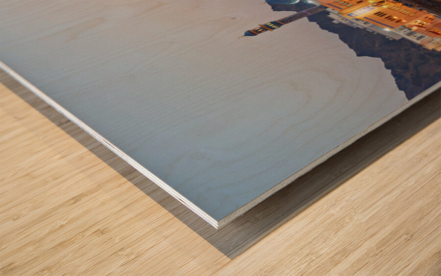 Sunset view of waterfront in Muscat Oman with city lights Wood print