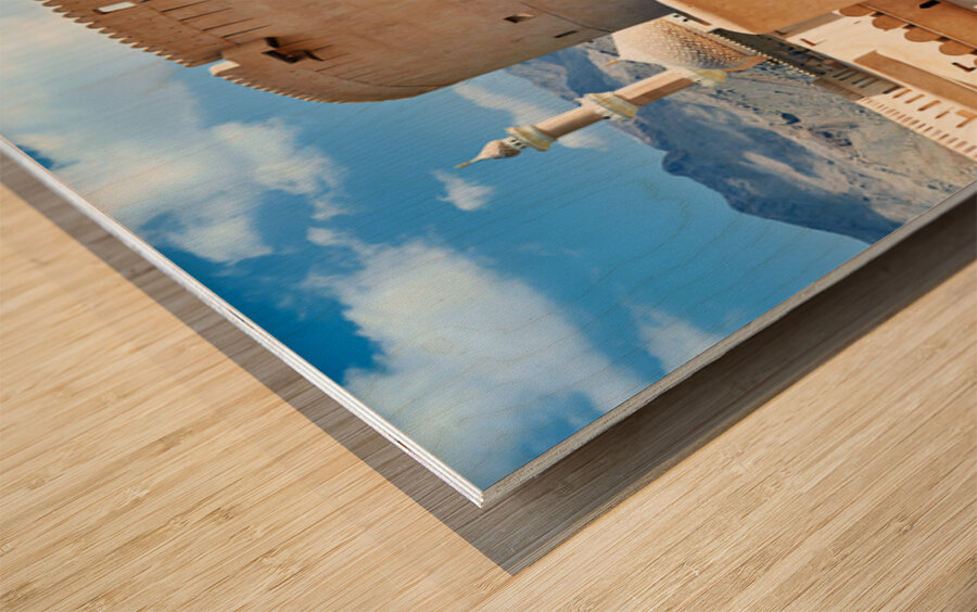 Visitors explore Nizwa Fort a historic site in Oman Wood print