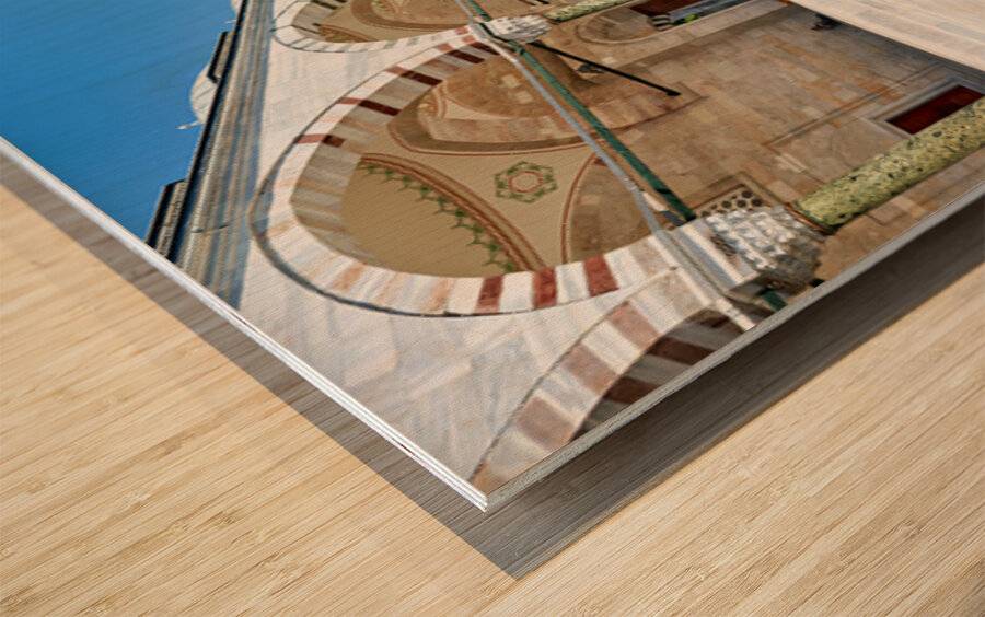 Visitors explore the courtyard at Fatih Mosque in Istanbul Wood print