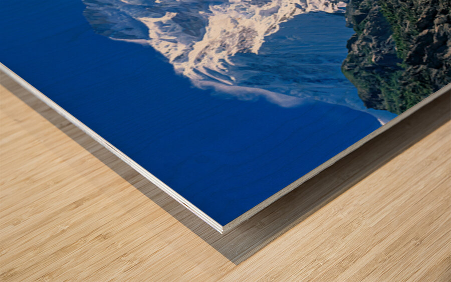 Karakoram range shows snow capped peaks and rocky terrain Wood print