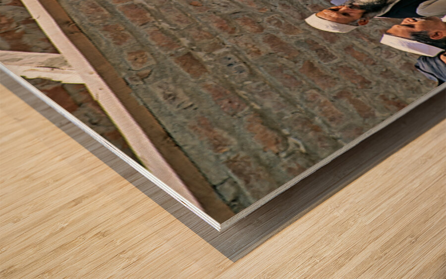 Men heading to work in Peshawar streets during morning hours Wood print