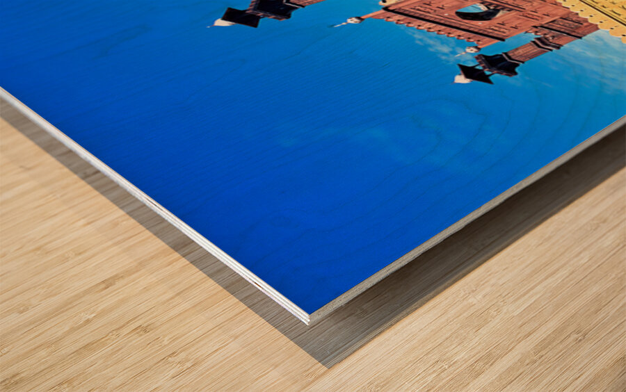 Mosque stands tall in Lahore with clear blue sky above Wood print