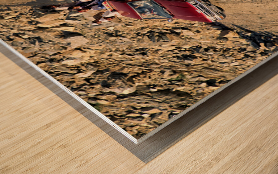 Travelers on gravel road near Shandur Pass in Pakistan Wood print