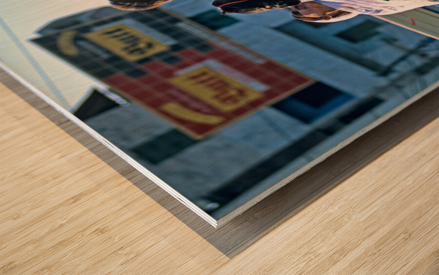 Family travels on rickshaw in busy Lahore streets Wood print