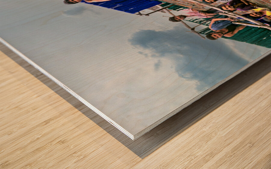 Workers rest during break time at a construction site in Lahore Wood print