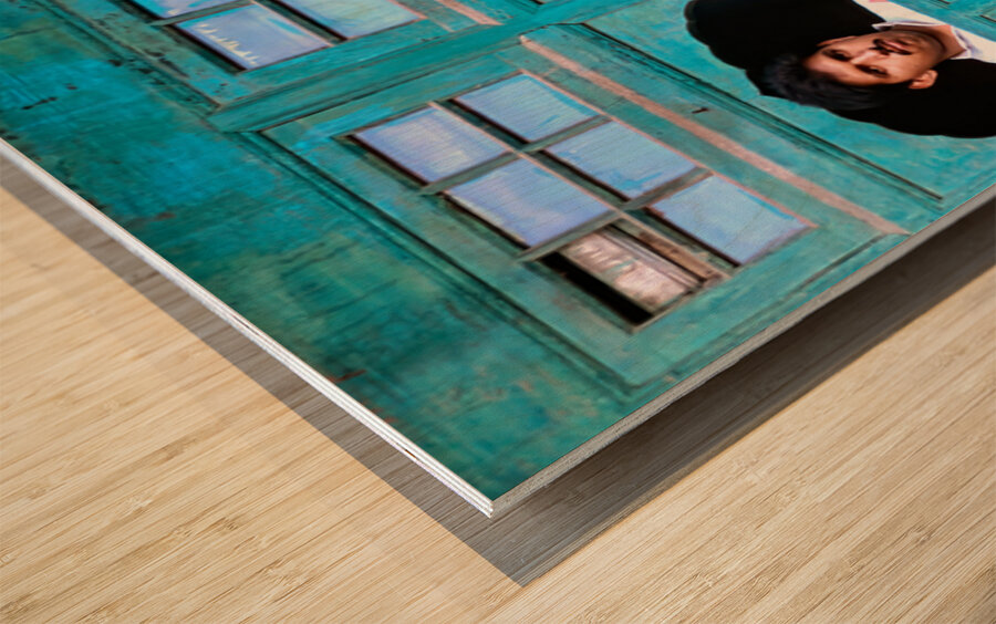 Man looks out from window in Lahore Pakistan Wood print
