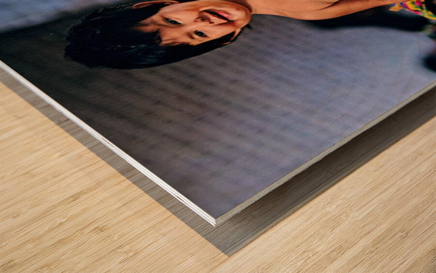 Kid stands at vegetable market in Samarkand Uzbekistan Wood print