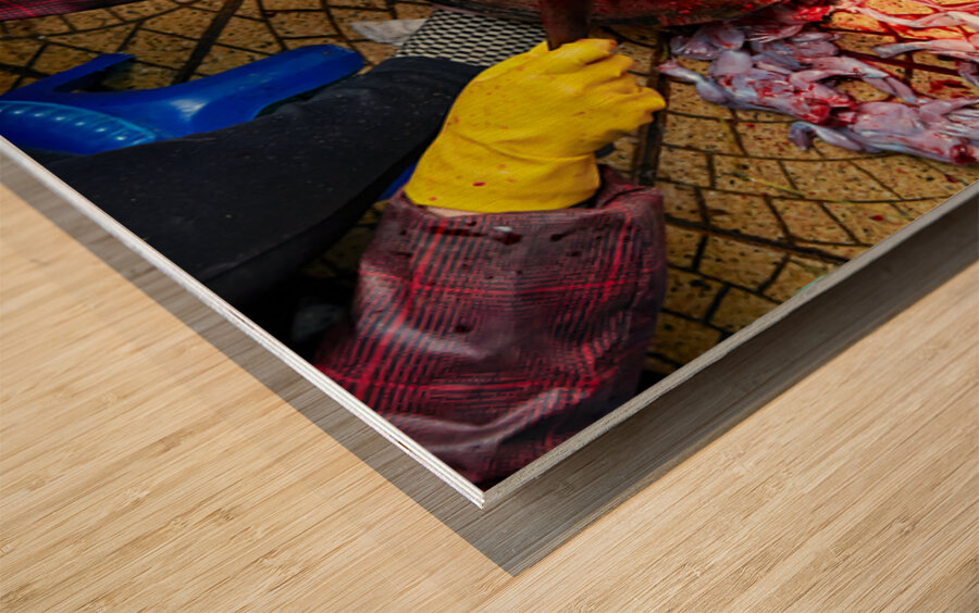 Fresh fish preparation at market in Hanoi during midday Wood print