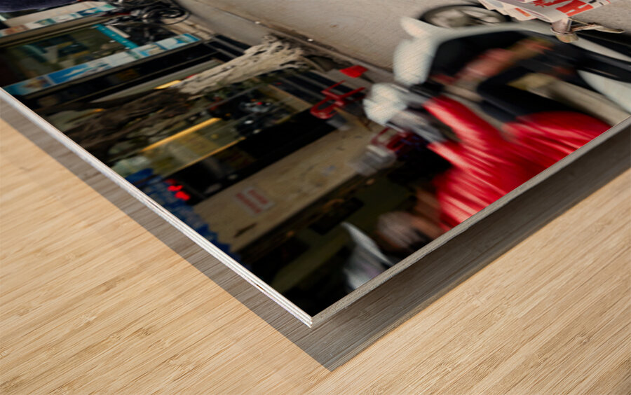 Man selling newspapers in Ho Chi Minh City Wood print