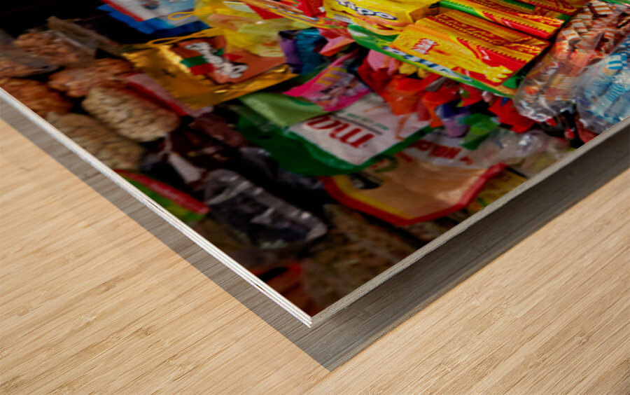 Cat sitting on boxes in Hanoi market during daytime Wood print