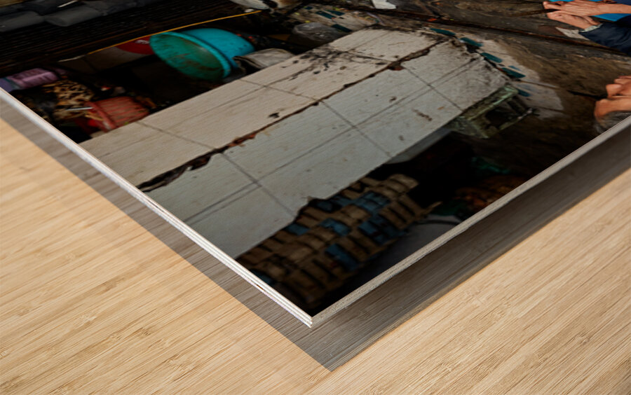 Women preparing fish in a market in Hanoi Vietnam Wood print