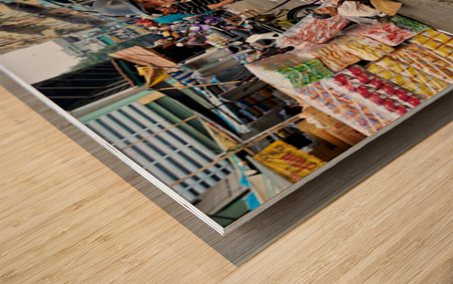 Motorbike family ride through busy Ho Chi Minh street in Vietnam Wood print