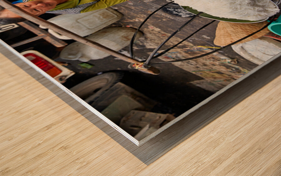 Woman selling food at street market in Ho Chi Minh City Wood print