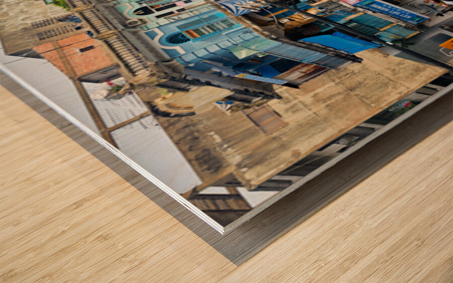 Busy street scene in Ho Chi Minh City with motorbikes and shops Wood print