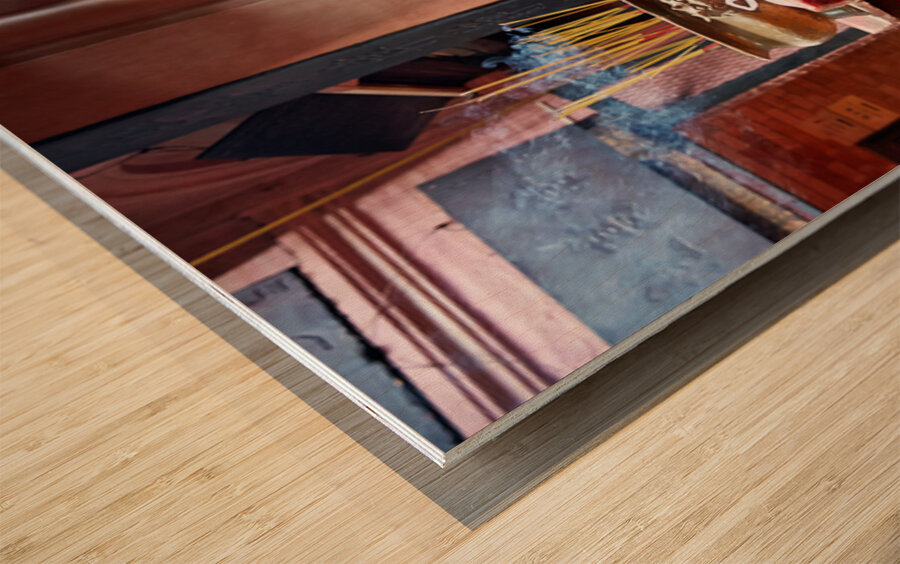 Woman prays at a temple in Ho Chi Minh City Vietnam Wood print