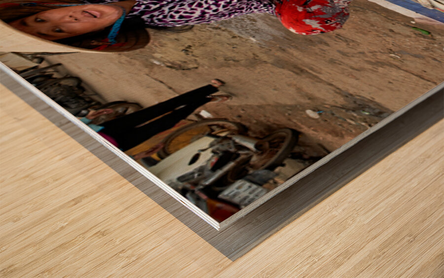 Fish seller in Phu Quoc market shows fresh catch for sale Wood print