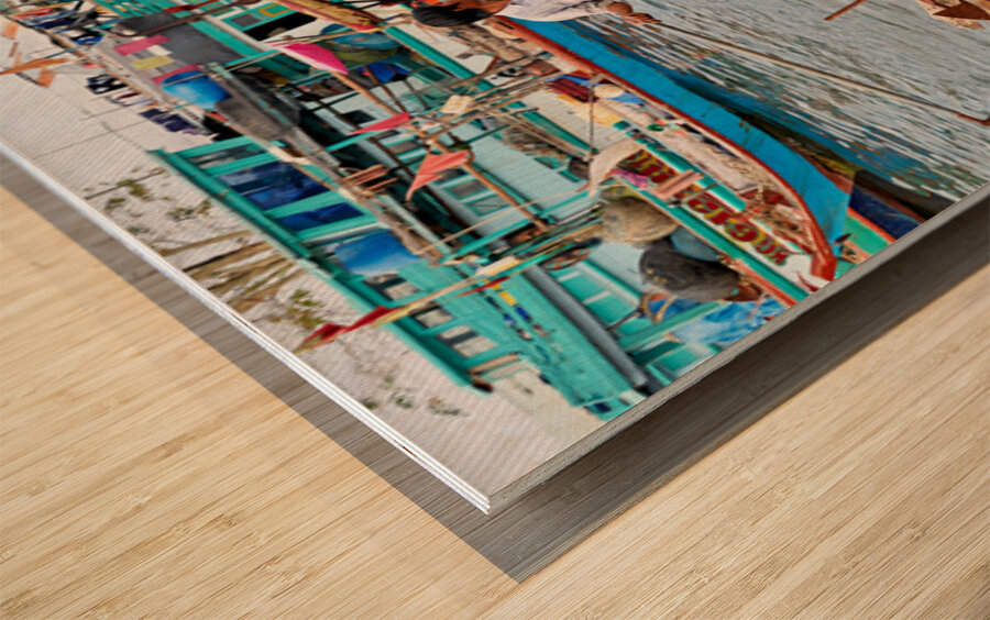 Fishing boat on water in Phu Quoc Vietnam during the day Wood print