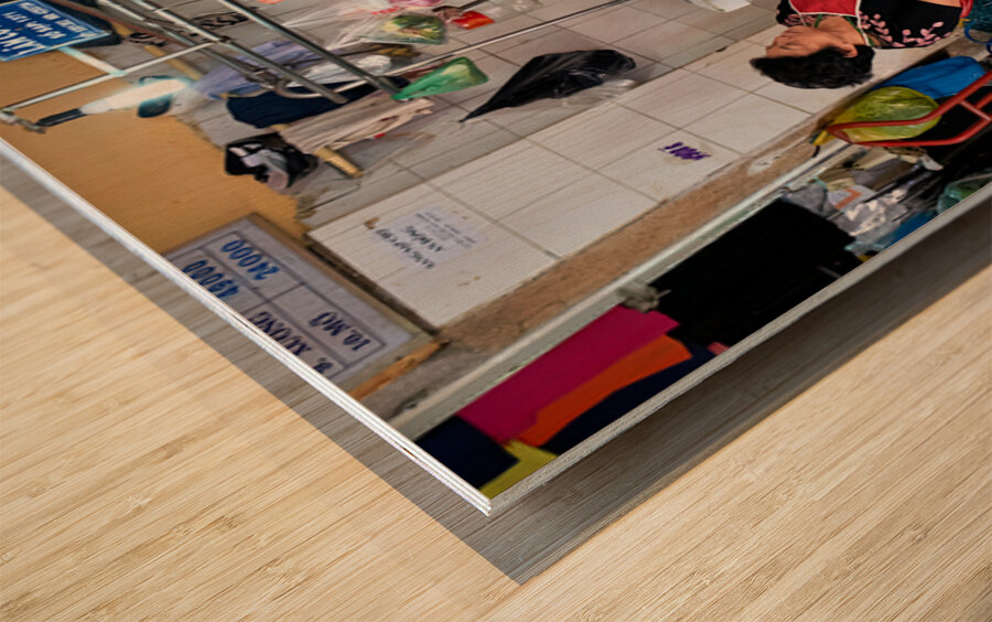 Market scene in Ho Chi Minh City with meat vendor and customer Wood print
