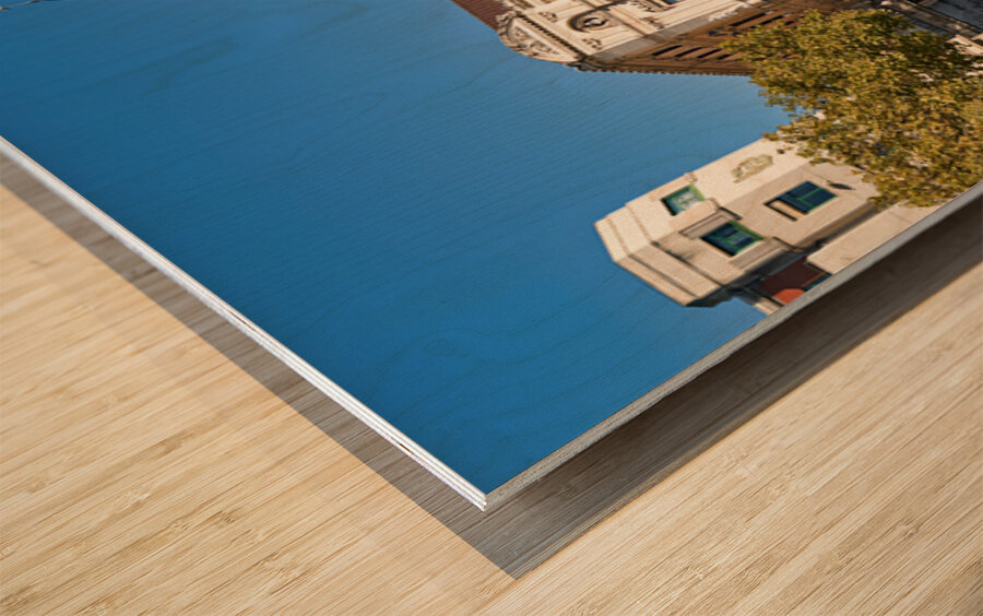 Building stands in Bilbao Spain next to water and trees Wood print