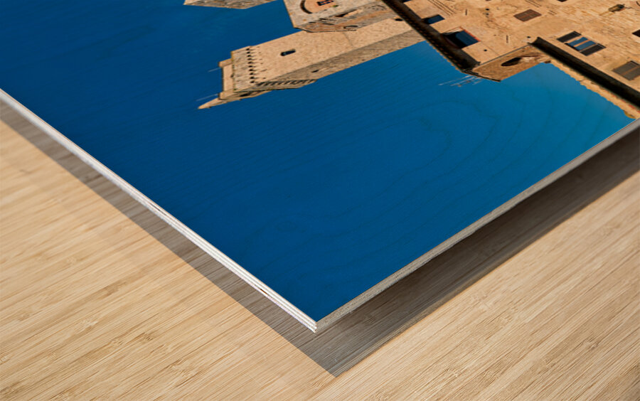 Visitors explore Piazza della Cisterna in San Gimignano Wood print