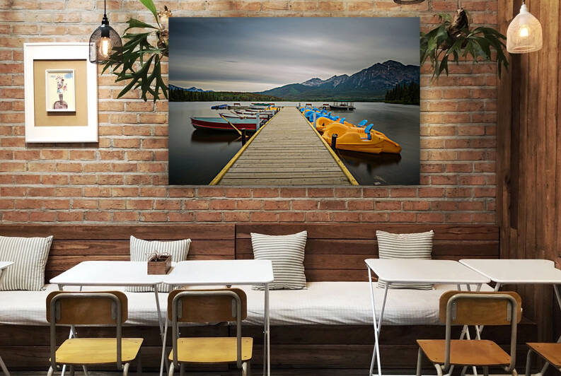 Boats on a jetty on the Pyramid Lake in Jasper National Park Canada by Nick Fox