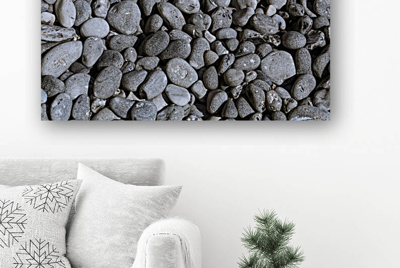 Black Cobbles on the beach by Werner Roelandt