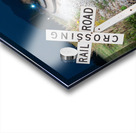 Oncoming train with railroad crossing sign Acrylic print