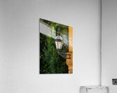 Historic english street lantern attached to warm stone building Acrylic Print