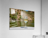 Glass of white wine by Douro river in Portugal Acrylic Print