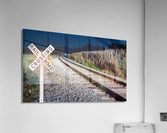 Oncoming train with railroad crossing sign Acrylic Print