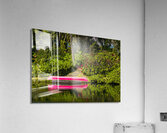 Red canoe on dock reflecting into calm lake or pond in garden Acrylic Print