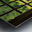 Barn swallow perched on the bars of window of 13th Century forti Metal print