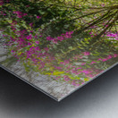 A vintage wooden rocking chair with a straw hat rests on a porch Impression metal