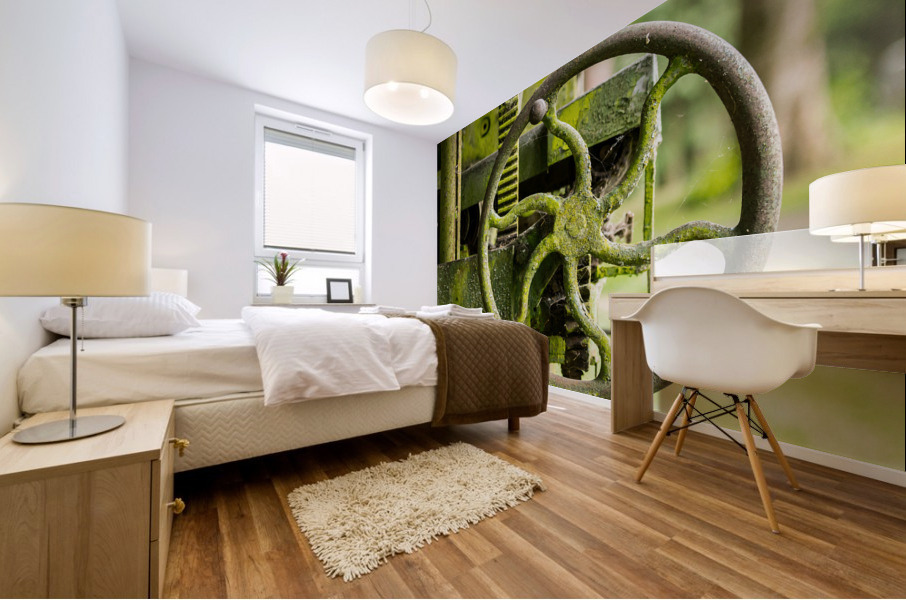 Moss covered farm machinery with handle Mural print