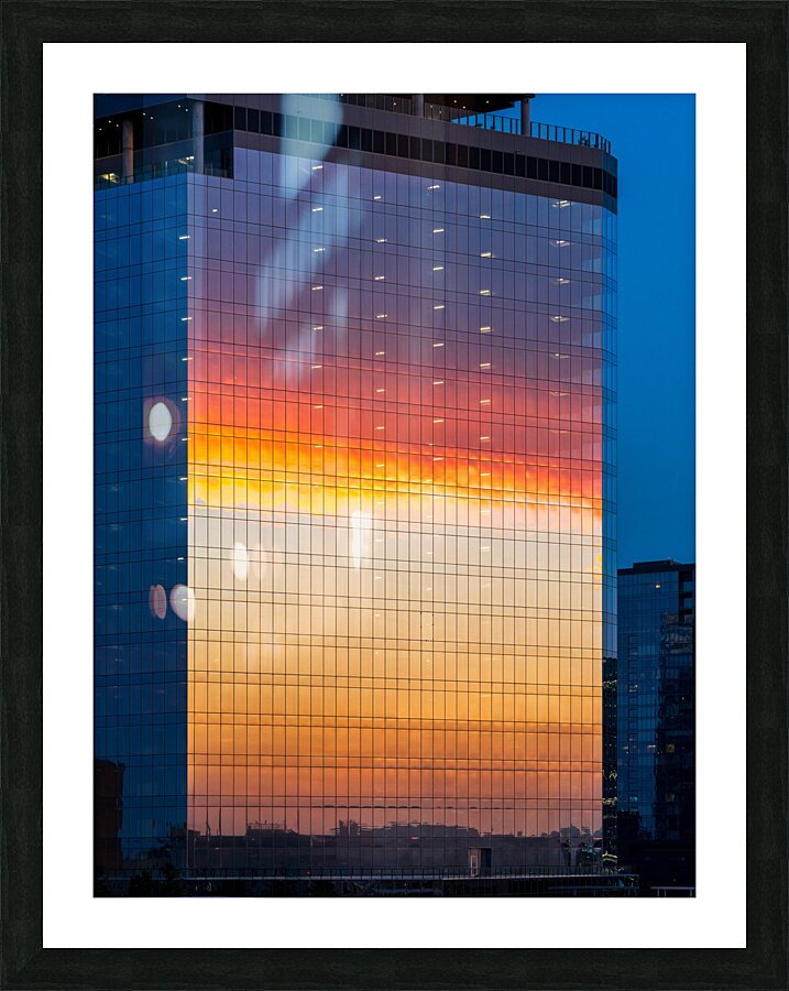 Brilliant sunset reflected in the glass of new office building Picture Frame print