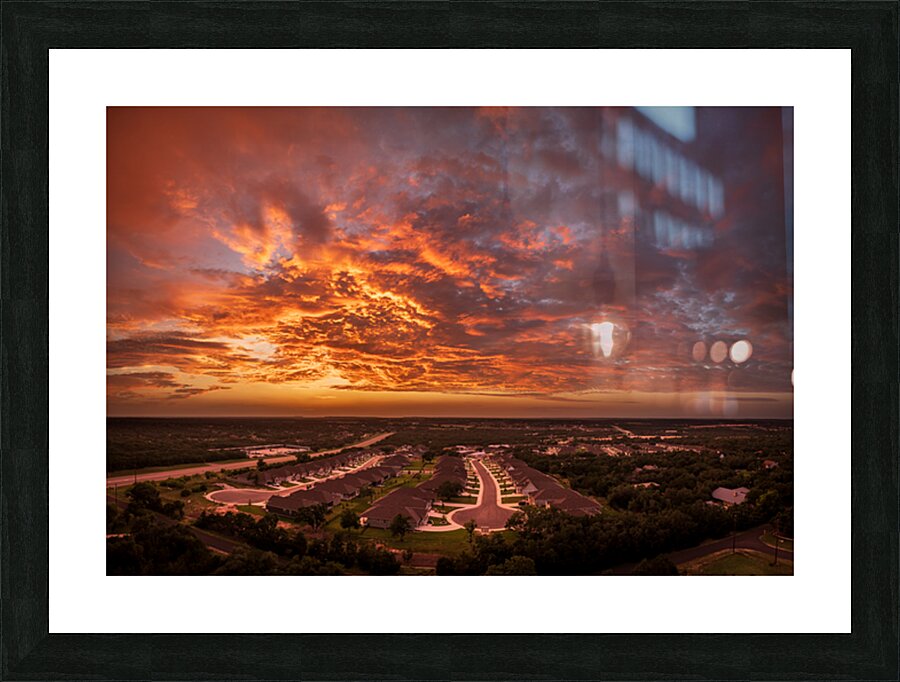 Dramatic sunset seen from drone over Georgetown Texas residentia Picture Frame print