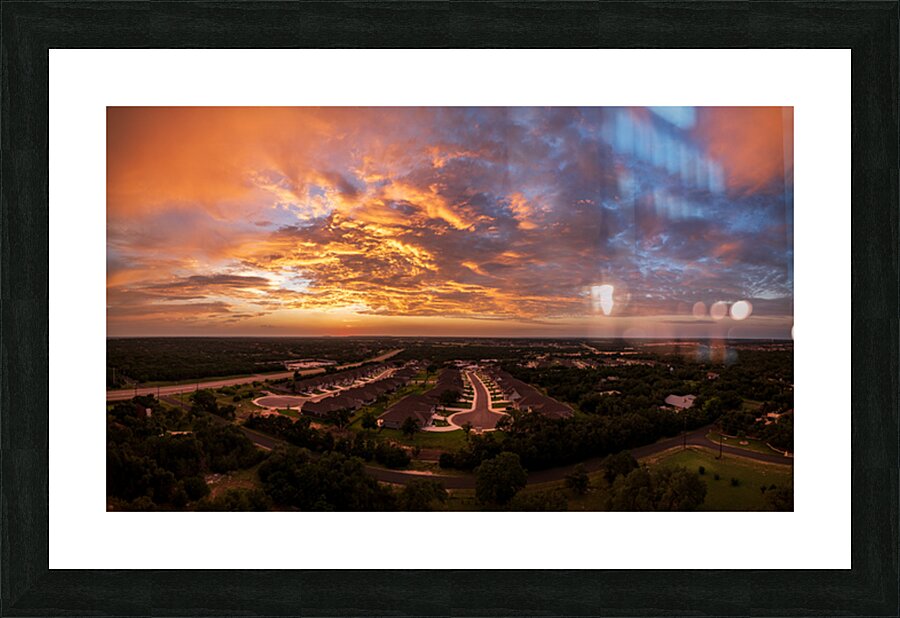 Dramatic sunset seen from drone over Georgetown Texas residentia Picture Frame print