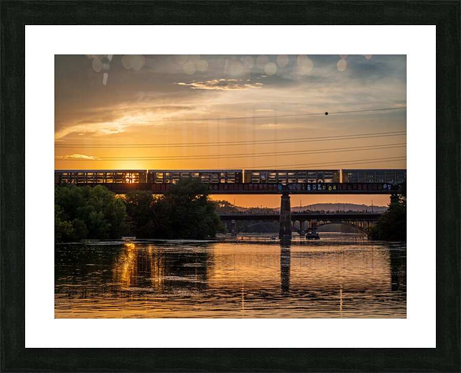 Freight train on the railroad bridge in Austin at sunset Picture Frame print