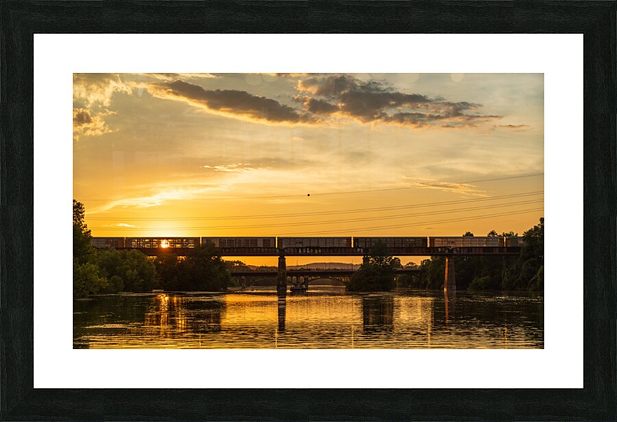 Freight train on the railroad bridge in Austin at sunset Picture Frame print