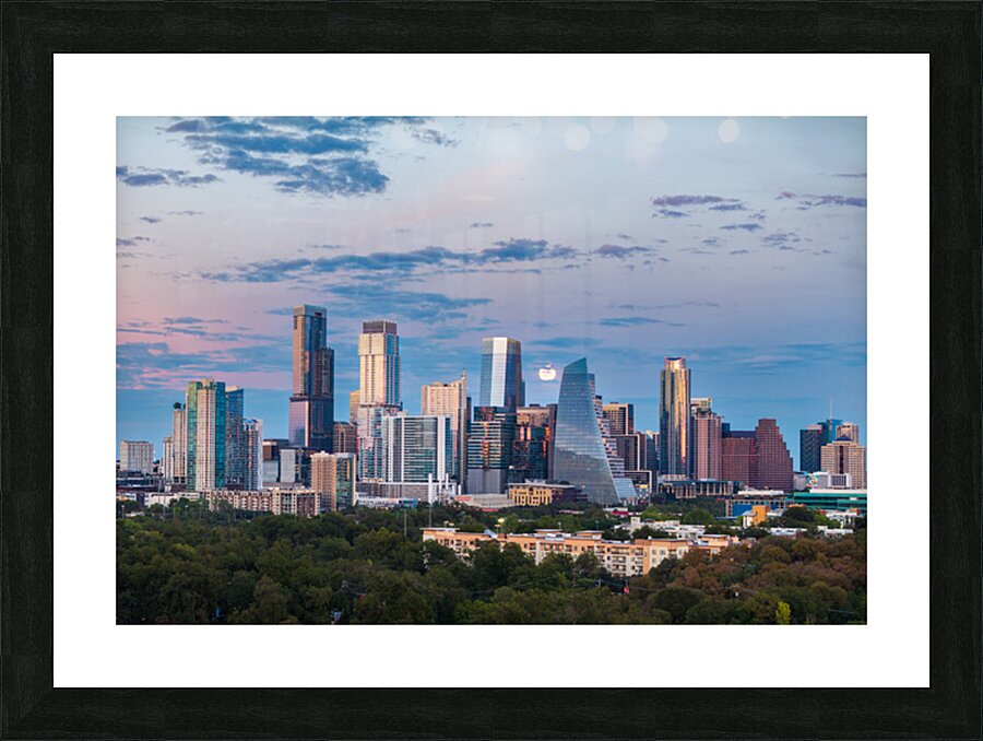 Distant view of Harvest moon in the Austin skyline at sunset Picture Frame print
