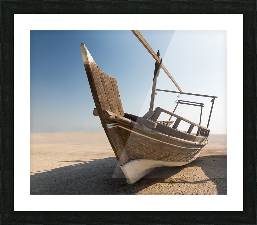 Fishermans boat or dhow on sand Picture Frame print