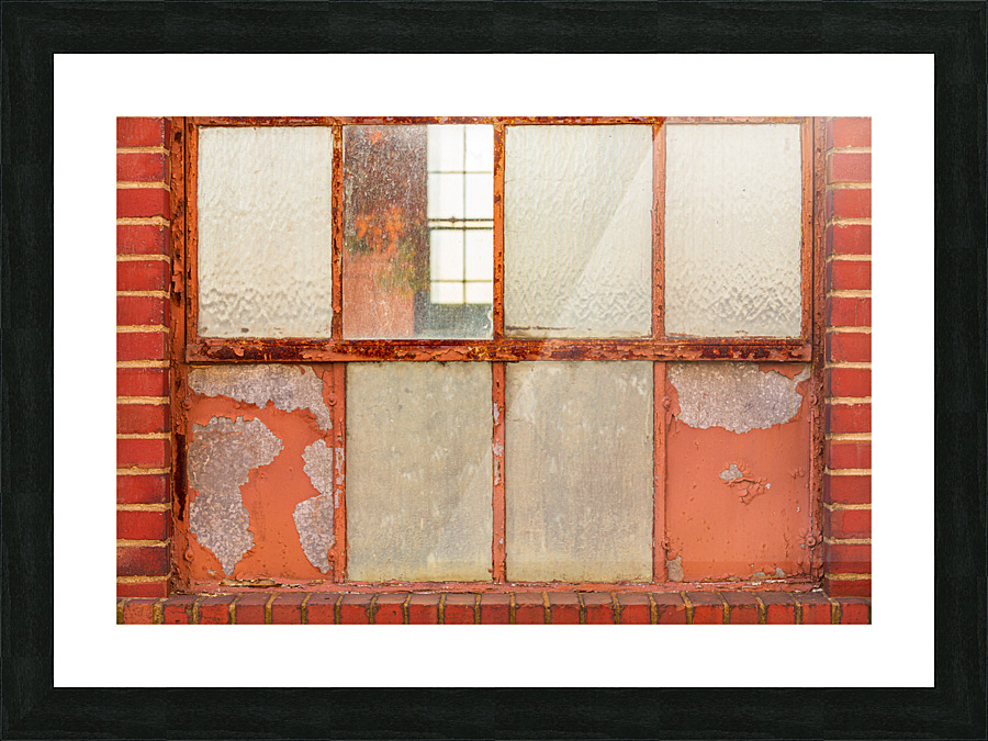 Old rusty window in warehouse painted red and orange Picture Frame print