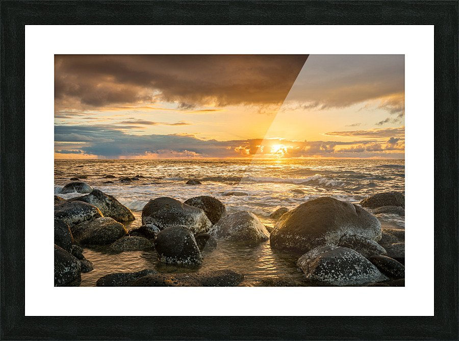 Sunset over rocks from Kee Beach Picture Frame print