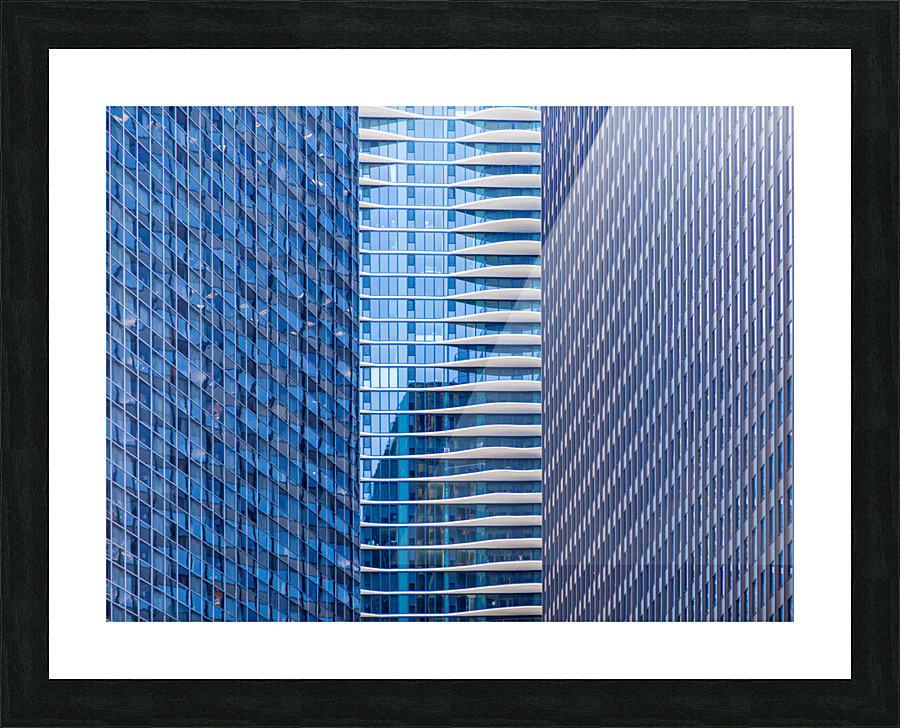 Distinctive hotel between skyscrapers Picture Frame print