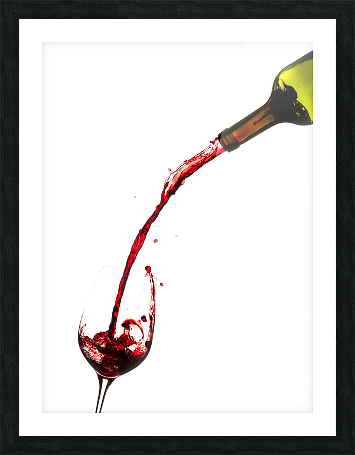 Wine pouring from bottle into glass Picture Frame print